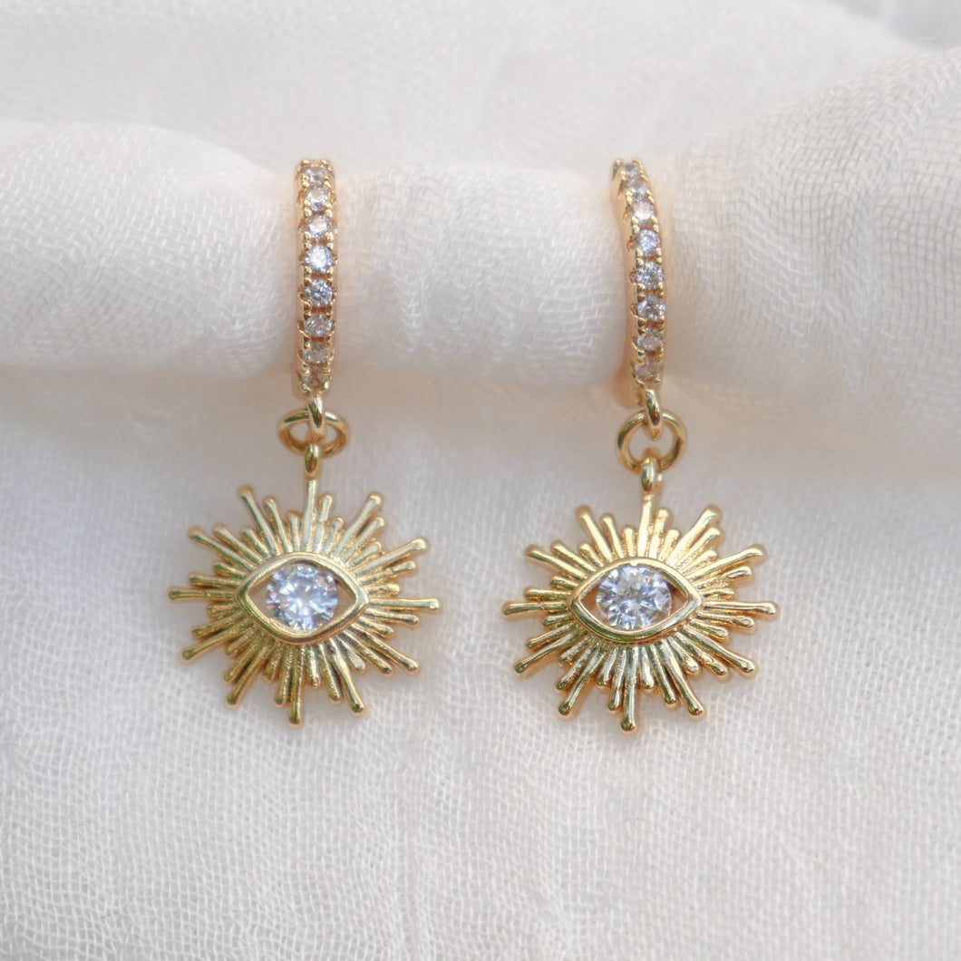 Real Eyes Huggie Earrings